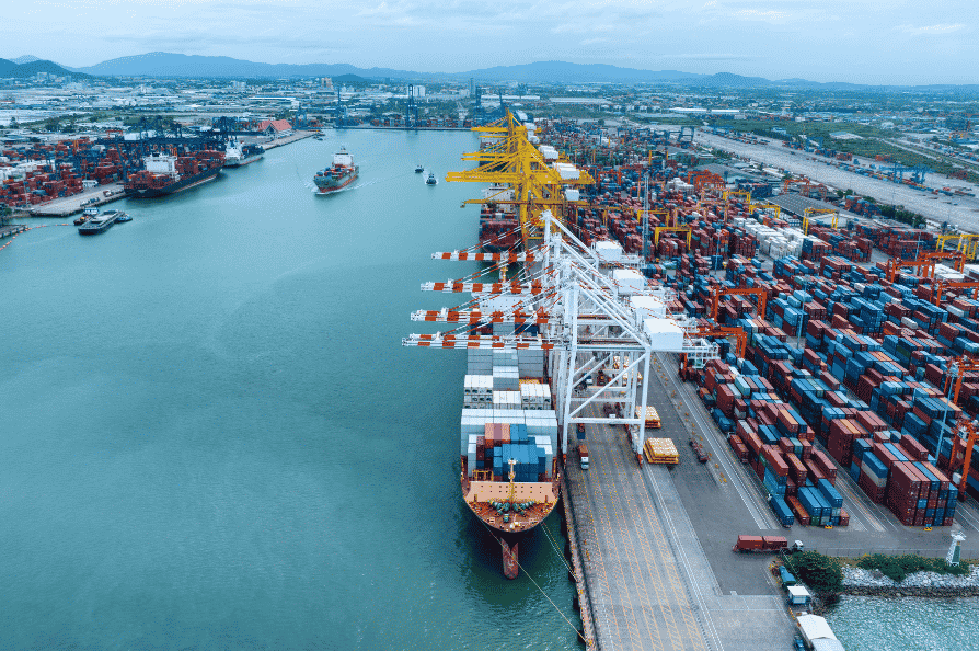 Air cargo aircraft and container ship illustrating air freight and sea freight options for businesses in Tanzania.